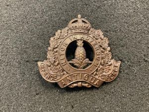 Antigua Defence Force WW1 bronze helmet badge.