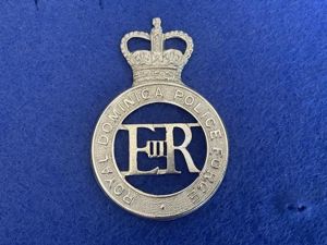 Q/C Royal Dominica Police Force helmet plate.