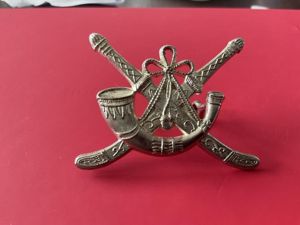 Oman Frontier Regiment cap badge.