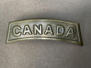 WW1 CANADA brass title stamped CARON BROS MONTREAL 1916.