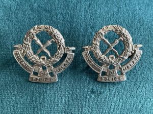 1940-50s Federation of Malaya Police collar badges.