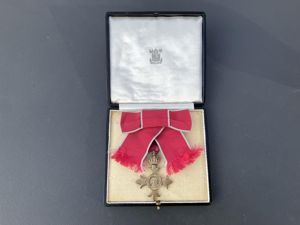 Full size boxed O.B.E (Silver-gilt) medal by Royal Mint.