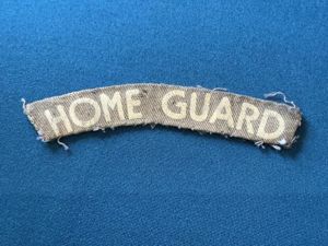 WW2 Printed HOME GUARD cloth shoulder title.