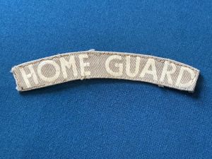 WW2 Printed HOME GUARD cloth shoulder title.