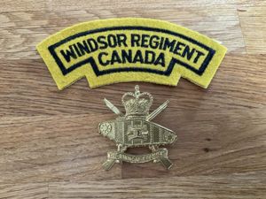 The Windsor Regiment of Canada cap badge & shoulder title.