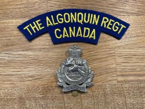 The Algonquin Regt of Canada cap badge & shoulder title.