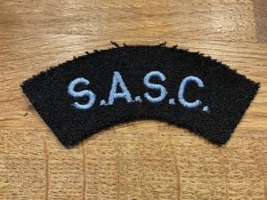 S.A.S.C (Small Arms School Corps) cloth shoulder title.