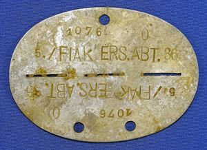 WWII German Erkennungsmarke Identification Disk: '1076 5./ Flak Ers. Abt. …