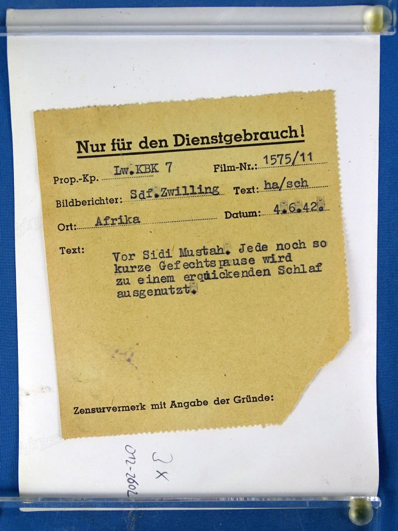 1942 Official Photograph: Afrika Korps Soldier Grabs Sleep in a Hole — image 2