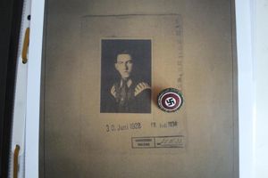 SMALL IDENTIFIED GOLD PARTY BADGE WITH RESEARCH INCLUDING PHOTO