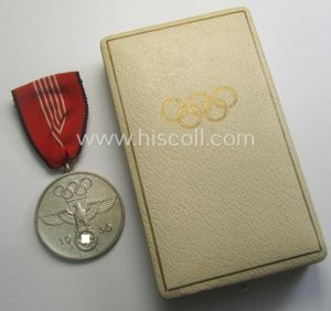'Deutsche Olympia-Erinnerungsmedaille 1936' being a non-maker-marked example that comes mounted …