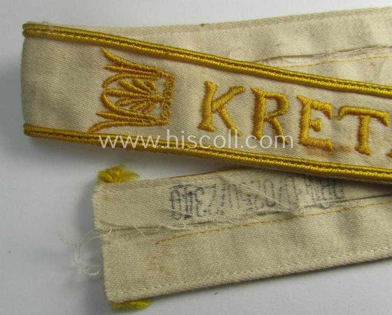 WH cuff-title (ie. 'Ärmelstreifen') entitled: 'Kreta' (being an example that bears a printed 'RbN.'-numeral) and that comes in a surely issued albeit simply never worn nor once tunic-attached, condition — image 2