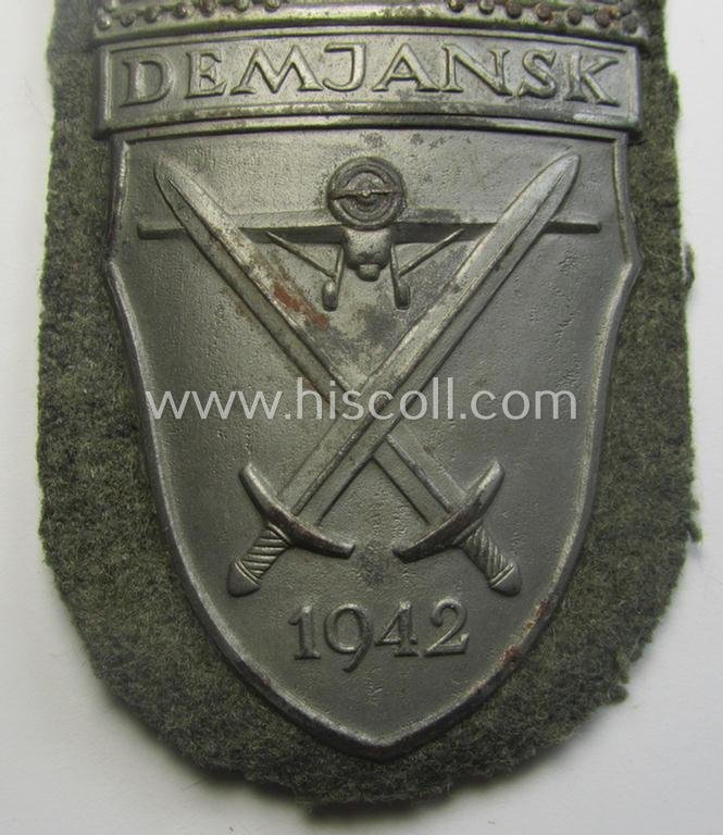 WH (Heeres ie. Waffen-SS) 'Demjansk'-campaign-shield as executed in typical magnetic metal (ie. so-called: 'Eisenblech') and that comes in an overall very nice- ie. fully untouched, condition — image 2