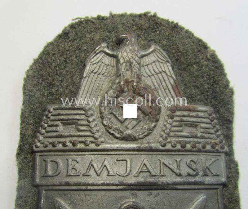 WH (Heeres ie. Waffen-SS) 'Demjansk'-campaign-shield as executed in typical magnetic metal (ie. so-called: 'Eisenblech') and that comes in an overall very nice- ie. fully untouched, condition — image 3