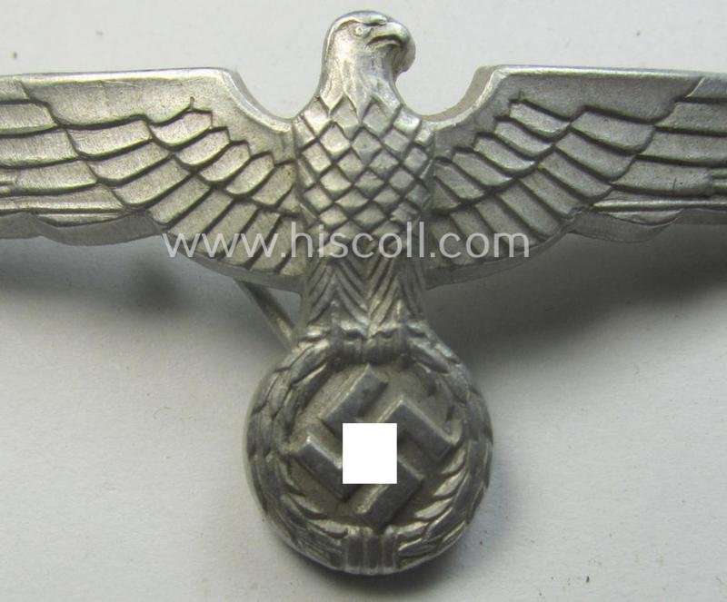 WH (Heeres) bright-silver-toned (ie. typical aluminium-based), EM- (ie. NCO- or officers') type visor-cap-eagle being a maker- (ie. 'R.H.'-) marked and/or: '1938'-dated example that comes in a moderately used- ie. once cap-attached-, condition — image 2