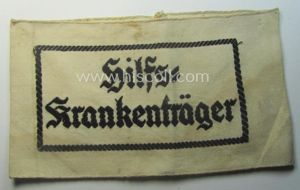 Beige-white-coloured- and/or linnen-based armband (ie. 'Armbinde') as was executed in …
