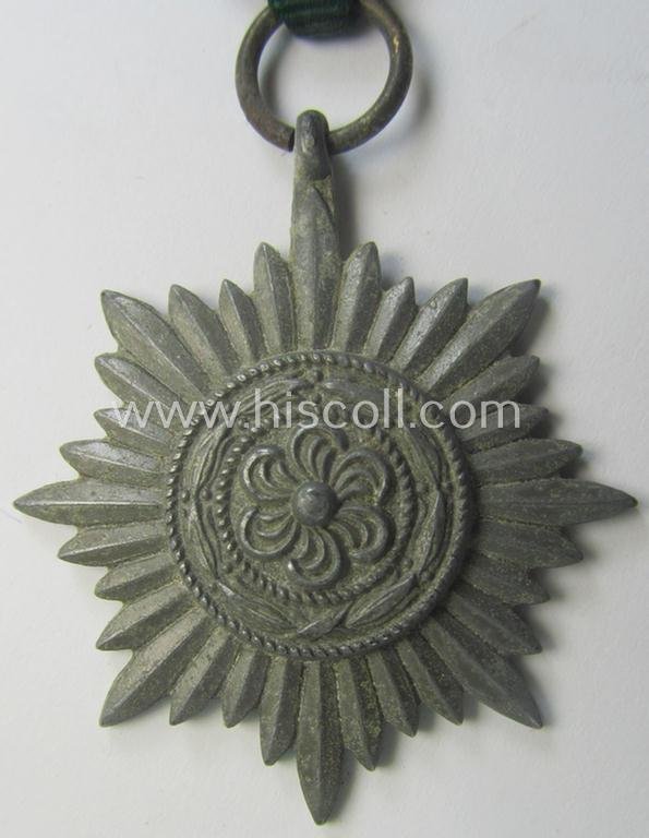 WH-related so-called: 'Verdienstauszeichnung für Angehörige der Ostvölker, 2. Klasse in Silber ohne Schwerter', being a typical non-maker-marked- and/or: 'Feinzink'-based example that comes mounted on its period ribbon — image 2