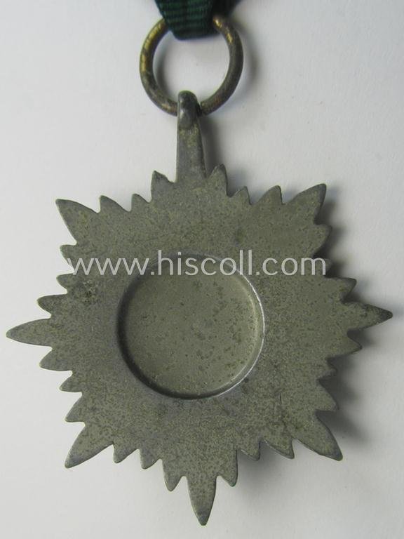 WH-related so-called: 'Verdienstauszeichnung für Angehörige der Ostvölker, 2. Klasse in Silber ohne Schwerter', being a typical non-maker-marked- and/or: 'Feinzink'-based example that comes mounted on its period ribbon — image 4