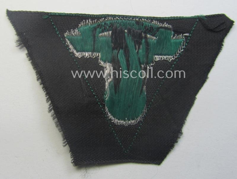 N.S.K.K. (ie. 'National Socialistisches Kraftfahr Korps') side-cap-eagle (ie. 'Adler für N.S.K.K.-Schiffchen o. Lagermütze') being a 'flat-wire-woven'-example onto a darker-green-coloured background — image 2