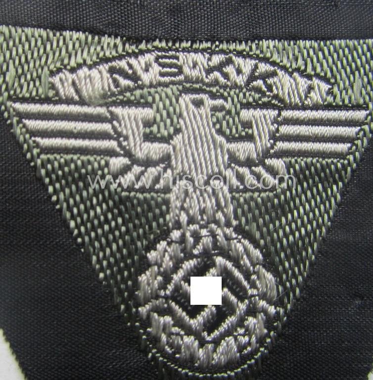 N.S.K.K. (ie. 'National Socialistisches Kraftfahr Korps') side-cap-eagle (ie. 'Adler für N.S.K.K.-Schiffchen o. Lagermütze') being a 'BeVo'-wove'-example onto a bright-grey-coloured background — image 2