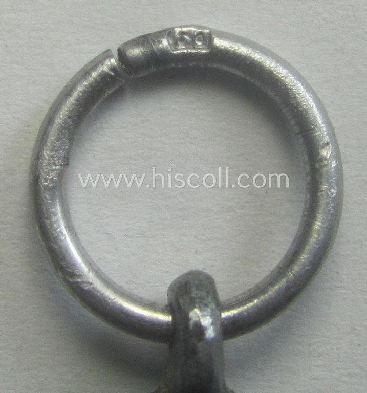 'Luftschutz-Ehrenzeichen 2. Stufe' being a maker- (ie. '10'-) marked example, as executed in zinc-based metal (ie. 'Feinzink') and that comes stored in its (scarcely seen!) 'Zellstoff'-based pouch by the maker: 'Katz u. Deyhle' — image 4