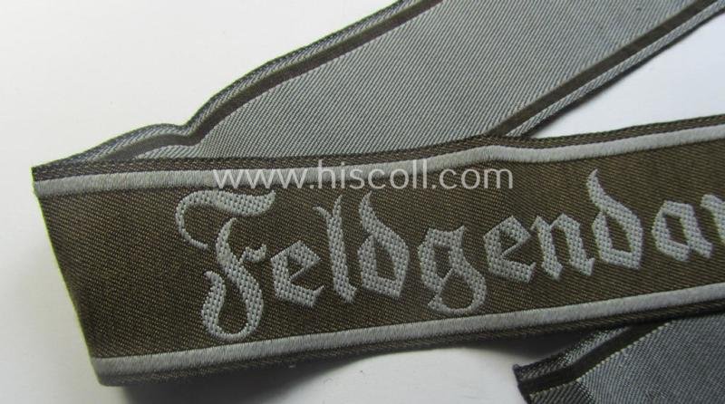 Hardly ie. never worn example of a WH (Heeres) cuff-title ie. armband (ie. 'Ärmelstreifen') entitled: 'Feldgendarmerie' (being a typical 'BeVo'-woven example) — image 2