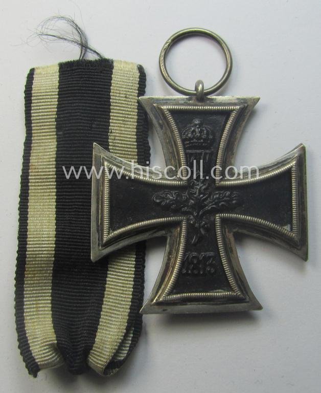 WWI-period: 'Eisernes Kreuz II. Klasse' (or: iron cross second class) being a (typical) non-maker-marked example that comes together with its (minimally) confectioned piece of ribbon (ie. 'Bandabschnitt') — image 3