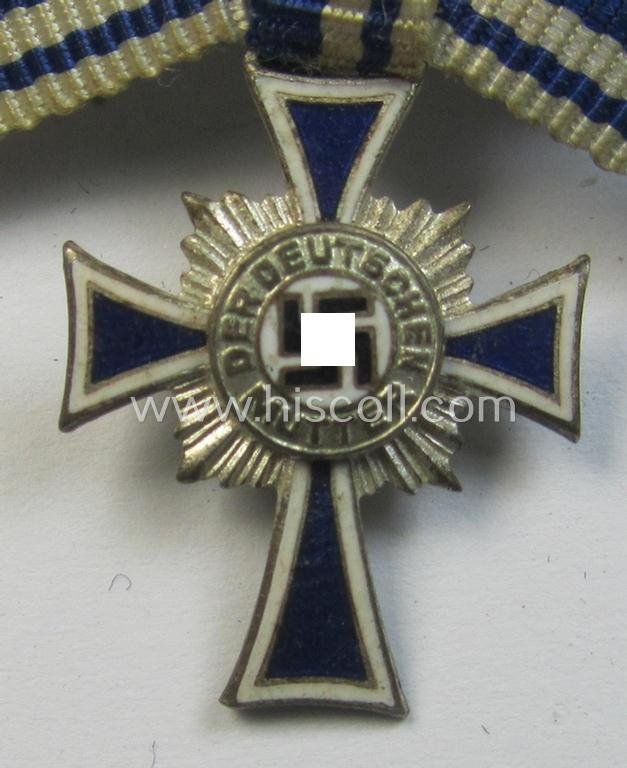 Miniature of an: 'Ehrenkreuz der deutschen Mutter - zweite Stufe' (or: silver-class mothers'-cross) being a non-maker-marked example that comes in an overall nice- (albeit moderately worn- ie. used-), condition — image 2