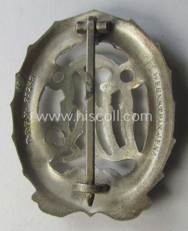 'Virtually mint' example of a: 'Reichssportabzeichen DRL in Silber' (or: DRL sports'-badge in silver) being a just moderately worn- ie. used example that is nicely maker- (ie. 'Wernstein - Jena'-) marked on its back — image 2
