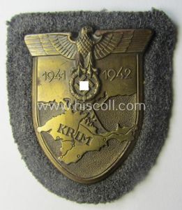 WH (Luftwaffe) 'Krim'-campaign-shield that comes mounted onto its original, bluish-grey-coloured …