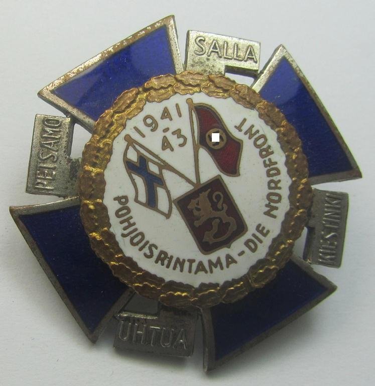 Finnish-/German: 'Nordfrontkreuz', being a white-/blue-coloured and maker- (ie. 'Hopeatakomo o.y.'-) marked 'variant' that shows the text: 'Pohjoisrintama - Die Nordfront - 1941/43' — image 5