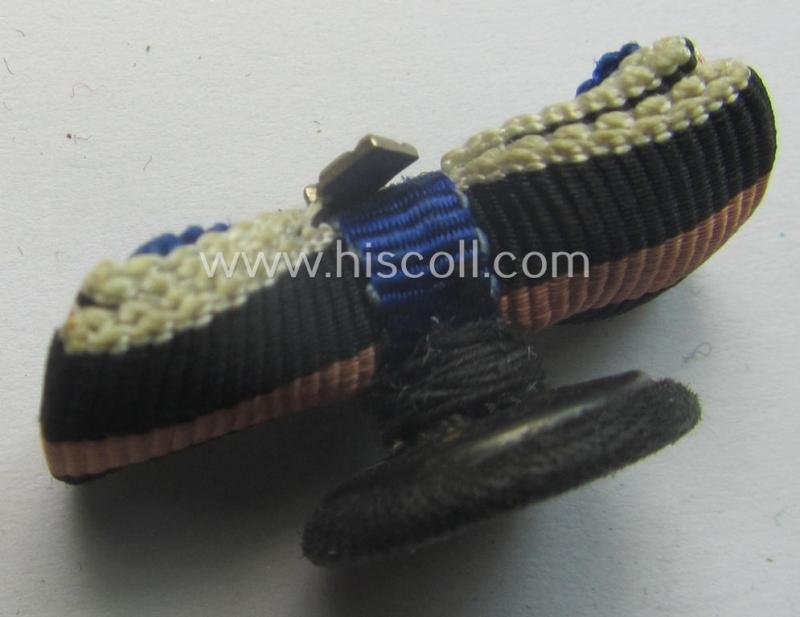 Interesting, 3-pieced WH (Luftwaffe) related ribbon-bar (ie. 'Feld- o. Bandspange') showing a: 'WH-DA 4. Stf.' and an Austrian- and/or Czech 'Anschluss'-medal and that comes mounted onto its specific 'button-hole'-set-up — image 2