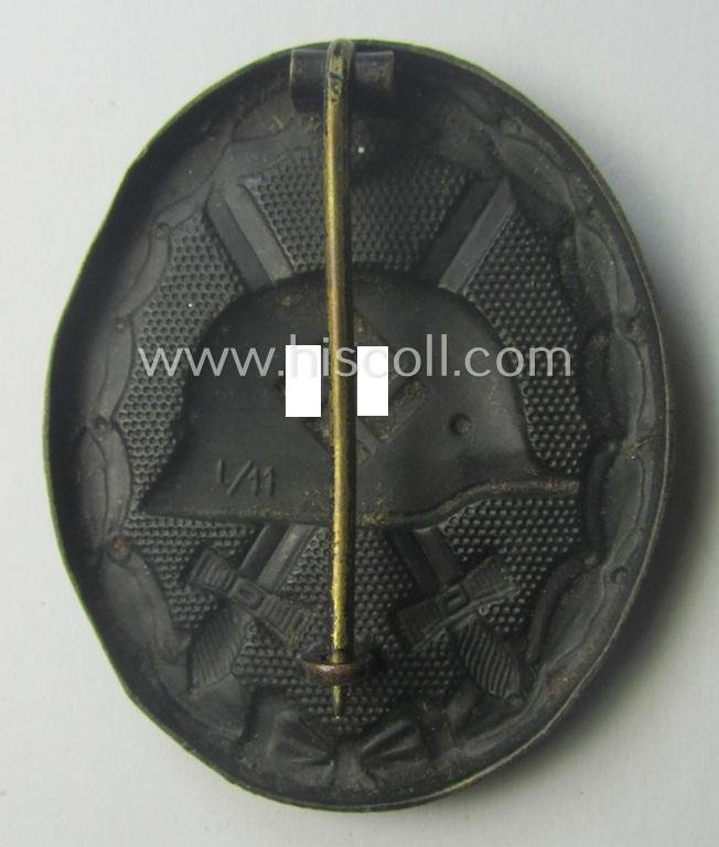 Clearly maker- (ie. 'L/11'-) marked example of a black-class wound-badge (or: 'Verwundeten-Abzeichen in Schwarz') being an example that was produced by the maker (ie. 'Hersteller') named: 'Wilhelm Deumer' — image 2