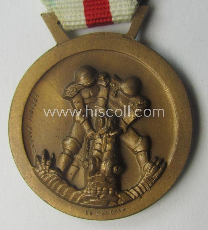 Golden-bronze-coloured- (and I deem 'Buntmetall'-based-) example of a: 'Deutsch-Italienische Feldzugsmedaille' (or: German-Italian campaign-medal) that comes mounted onto its (regular-sized) piece of original (and somewhat faded!) ribbon — image 2