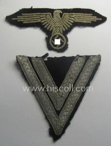 Clearly used- and/or tunic-removed, 2-pieced 'SS'- (ie. 'Waffen-SS'-) insignia-set comprising …