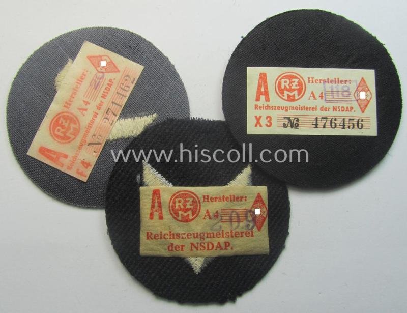 Interesting - and hardly ie. even never used! - 3-pieced, DJ- (ie. 'Deutsches Jungvolk in der HJ') insignia-set comprising of three darker-blue-toned rank-patches (ie. 'Rangzeichen') all three still holding their period-attached 'RzM'-etikets — image 2