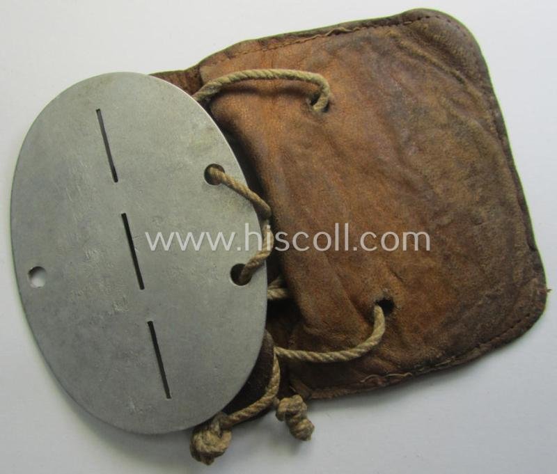 Aluminium-based, WH (Luftwaffe) ie. 'Luftnachrichten'-related ID-disc (ie. 'Erkennungsmarke') bearing the stamped unit-designation that reads: 'L.N. Komp. Wels' and that comes stored in its period (leather-based) pouch — image 4