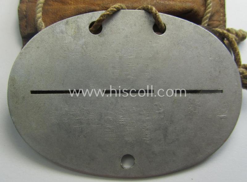Aluminium-based, WH (Luftwaffe) ie. 'Luftnachrichten'-related ID-disc (ie. 'Erkennungsmarke') bearing the stamped unit-designation that reads: 'L.N. Komp. Wels' and that comes stored in its period (leather-based) pouch — image 5
