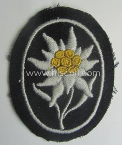 Waffen-SS-pattern, black-coloured sleeve-insignia (ie. 'Ärmelabzeichen') depicting an: 'Edelweiss'-flower as used …