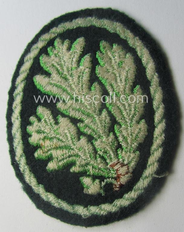 Truly used WH (Heeres) so-called: 'Jäger'-armbadge being a neatly machine-embroidered- and/or multi-coloured version as was executed on darker-green-coloured 'felt-based'-wool — image 2