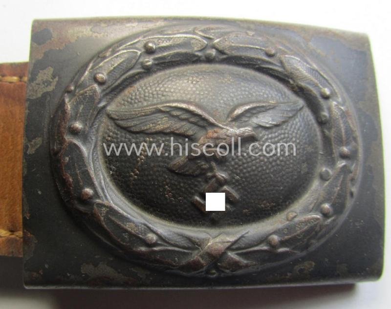 WH (Luftwaffe) bluish-grey-coloured, steel-based belt-buckle being a maker- (ie. 'R. Sieper & Söhne'-) marked example that comes mounted onto its leather-based tab — image 2