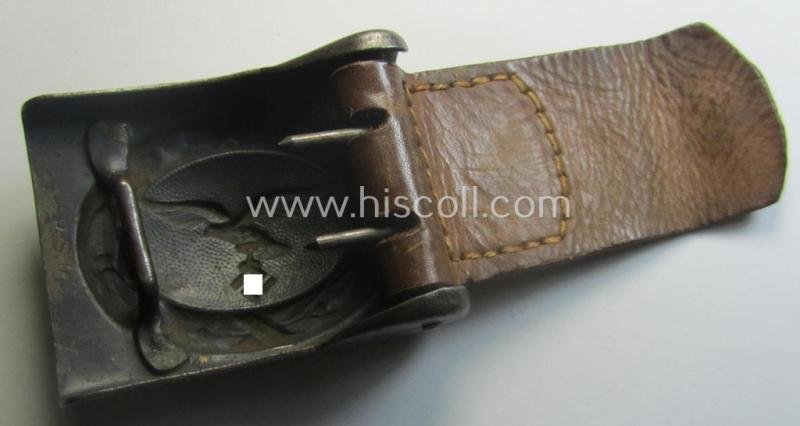 WH (Luftwaffe) bluish-grey-coloured, steel-based belt-buckle being a maker- (ie. 'R. Sieper & Söhne'-) marked example that comes mounted onto its leather-based tab — image 4
