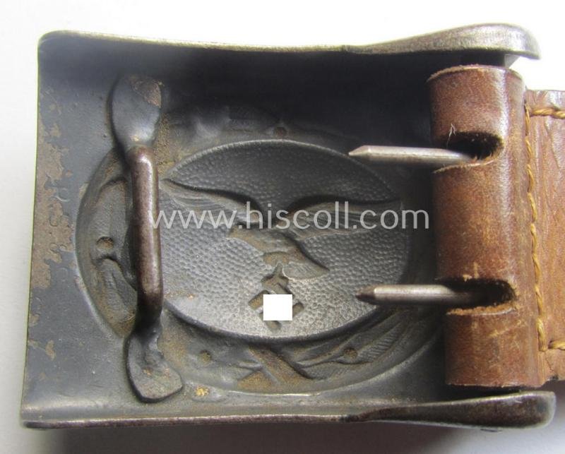 WH (Luftwaffe) bluish-grey-coloured, steel-based belt-buckle being a maker- (ie. 'R. Sieper & Söhne'-) marked example that comes mounted onto its leather-based tab — image 5