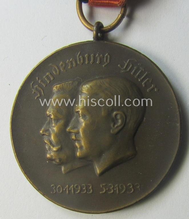 Darker-bronze-toned commemorative-medal (ie. 'Erinnerungs-Medaille') entitled: 'Hindenburg - Hitler - 30.1.1933 - 5.3.1933' and that comes mounted onto its period ribbon showing an interwoven swastika-device — image 3