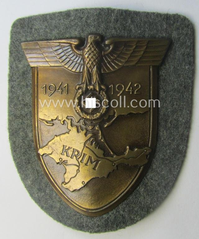 WH (Heeres ie. Waffen-SS) 'Krim'-campaign-shield (by the maker: 'Friedrich Orth') that comes stored in its period (and rarely seen!) 'Zellstoff'-based pouch and that comes in a probably issued- (albeit still 'virtually mint'-), condition — image 2