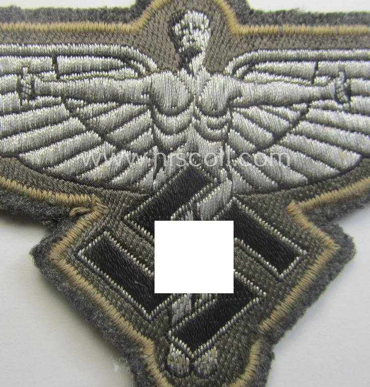Bluish- (ie. silver-) coloured, so-called: N.S.F.K.- (or: 'National Socialistisches Flieger Korps') breast-eagle being a nicely woven- (and officers'-pattern) example that comes mounted on its piece of bluish-grey-coloured linnen — image 2