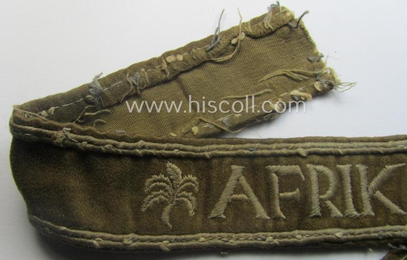 Neat, WH cuff-title (ie. 'Ärmelstreifen') entitled: 'Afrika' that comes in a clearly issued, worn- and/or most certainly once tunic-attached, condition — image 2