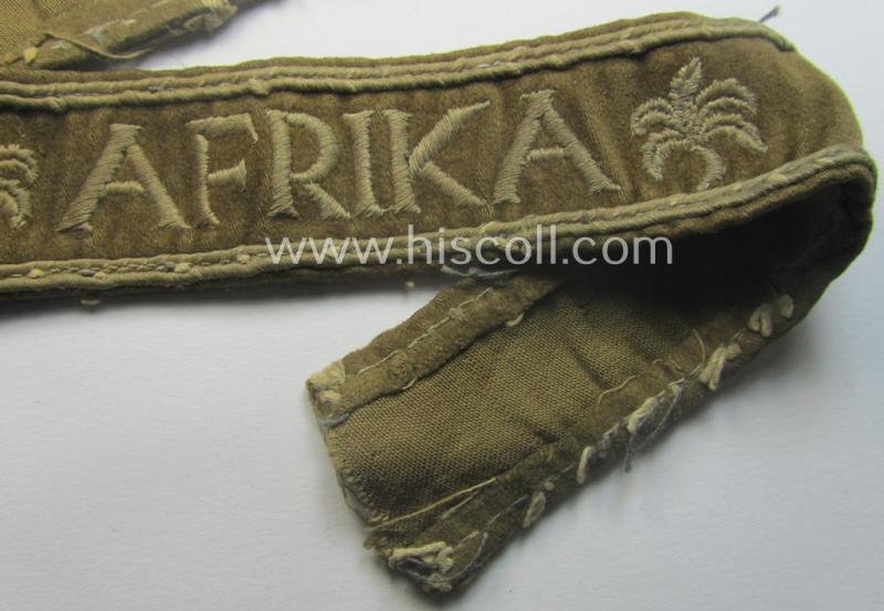 Neat, WH cuff-title (ie. 'Ärmelstreifen') entitled: 'Afrika' that comes in a clearly issued, worn- and/or most certainly once tunic-attached, condition — image 3