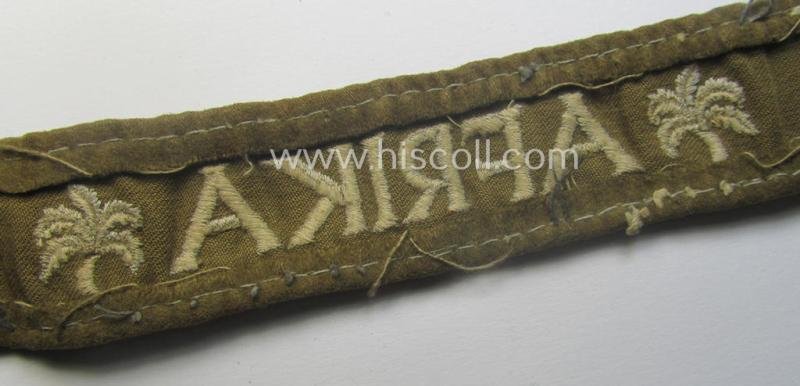 Neat, WH cuff-title (ie. 'Ärmelstreifen') entitled: 'Afrika' that comes in a clearly issued, worn- and/or most certainly once tunic-attached, condition — image 5