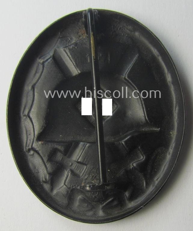 Nicely maker- (ie. '107-) marked example of a black-class wound-badge (or: 'Verwundeten-Abzeichen in Schwarz') being an example that was produced by the maker (ie. 'Hersteller') named: 'Carl Wild' — image 2